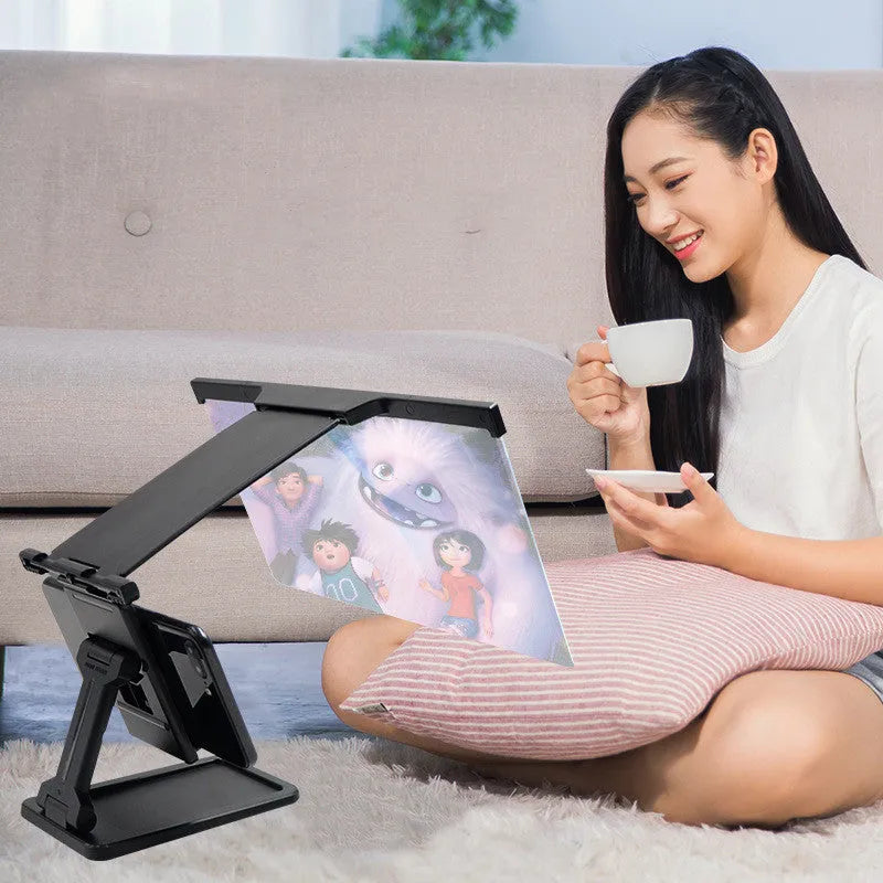 L20 black mobile phone screen magnifier with acrylic lens and separate stand on a table.