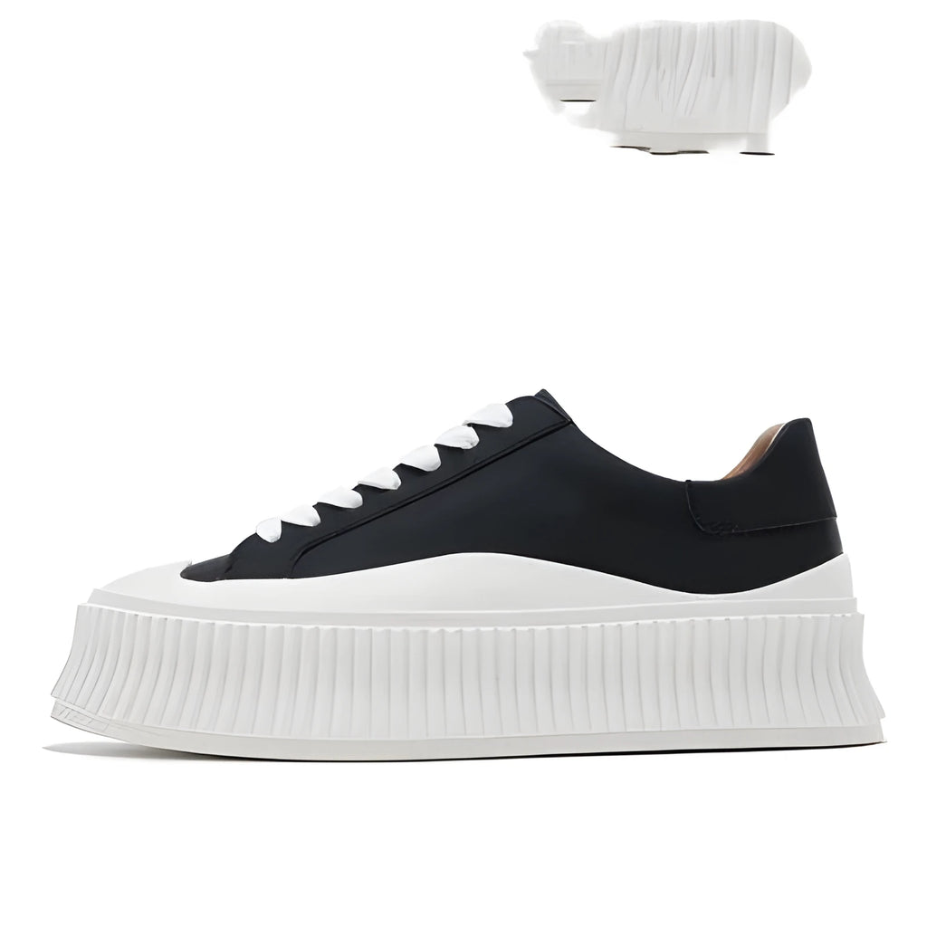 Women's black and white suede platform sneakers with back lacing and a thick sole for height increase.