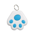 Small black dog paw shaped Bluetooth anti-lost device on a keyring next to a mobile phone.