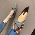 Women's red and black pointed-toe flat shoes with a low heel and cotton upper.