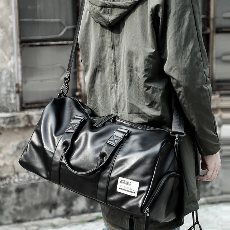 Large black waterproof PU leather sports training bag with multiple internal pockets and single strap