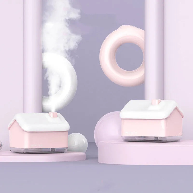 White igloo-shaped ultrasonic humidifier and essential oil diffuser with LED light on a desk.