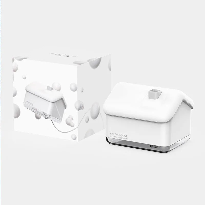 White igloo-shaped ultrasonic humidifier and essential oil diffuser with LED light on a desk.