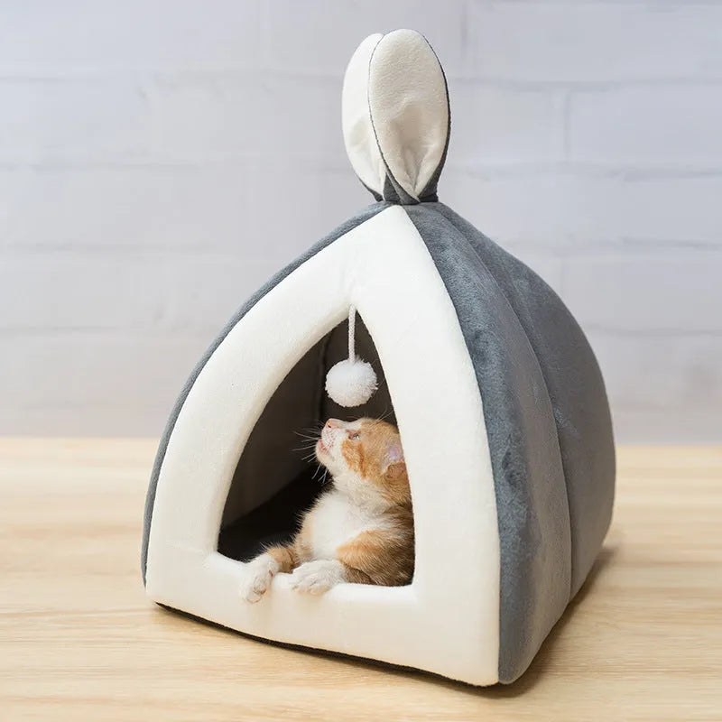 Grey cloth cat house with villa roof design showing interior space for pet resting