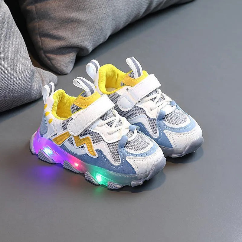 Children's black breathable mesh and PU Velcro sneakers with a rubber sole on a white background.