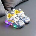 Children's black breathable mesh and PU Velcro sneakers with a rubber sole on a white background.