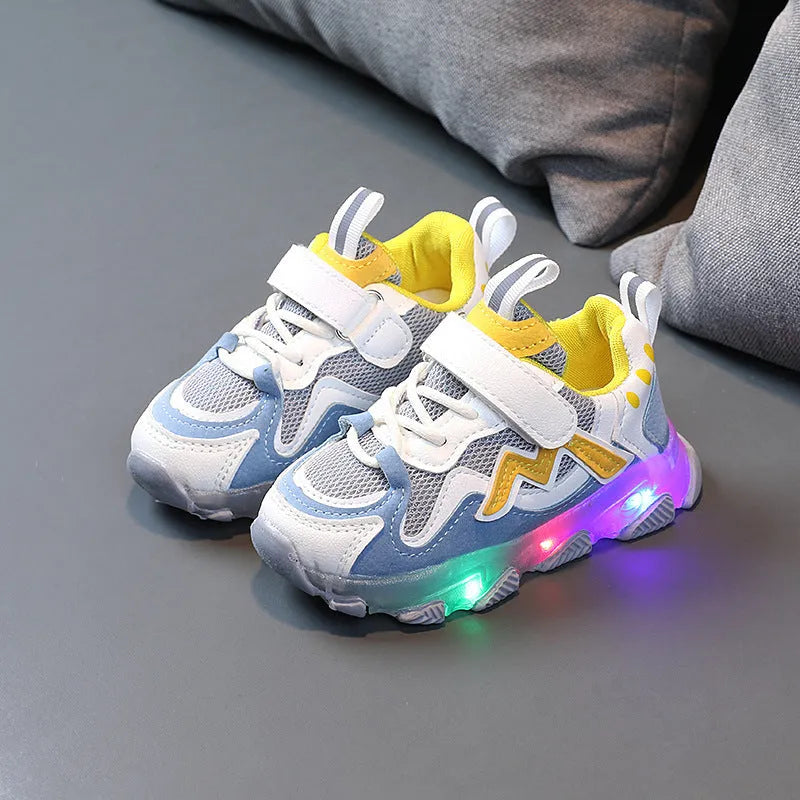 Children's black breathable mesh and PU Velcro sneakers with a rubber sole on a white background.