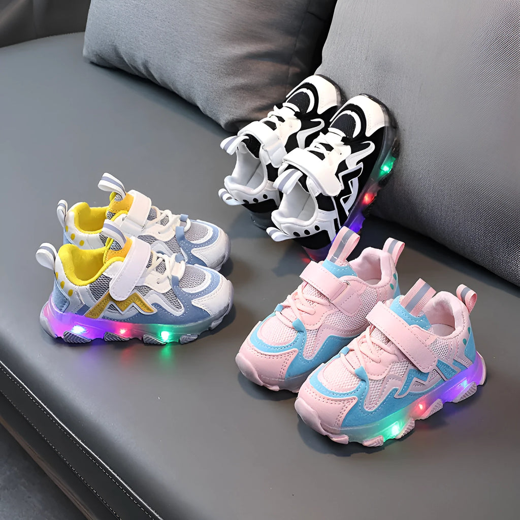 Children's black breathable mesh and PU Velcro sneakers with a rubber sole on a white background.