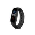 M5 smart fitness bracelet in black, blue, or red with heart rate and blood pressure monitoring on wrist.