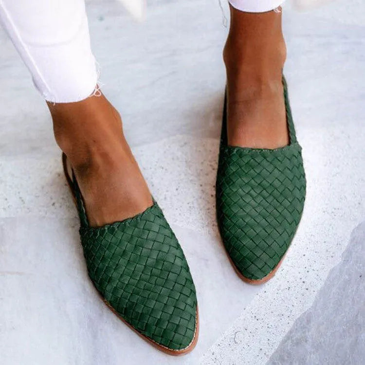 Pointed toe flat sandals with a buckle fastener on the upper, shown in a selection of colours.