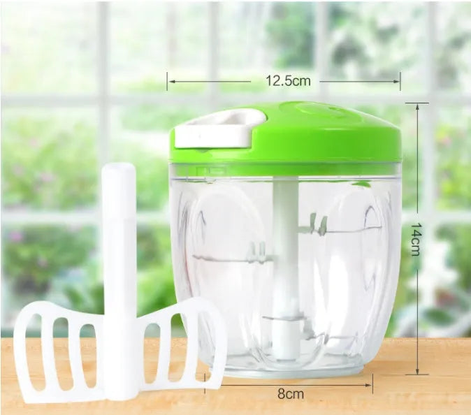 Manual kitchen chopper with stainless steel blades in green plastic housing