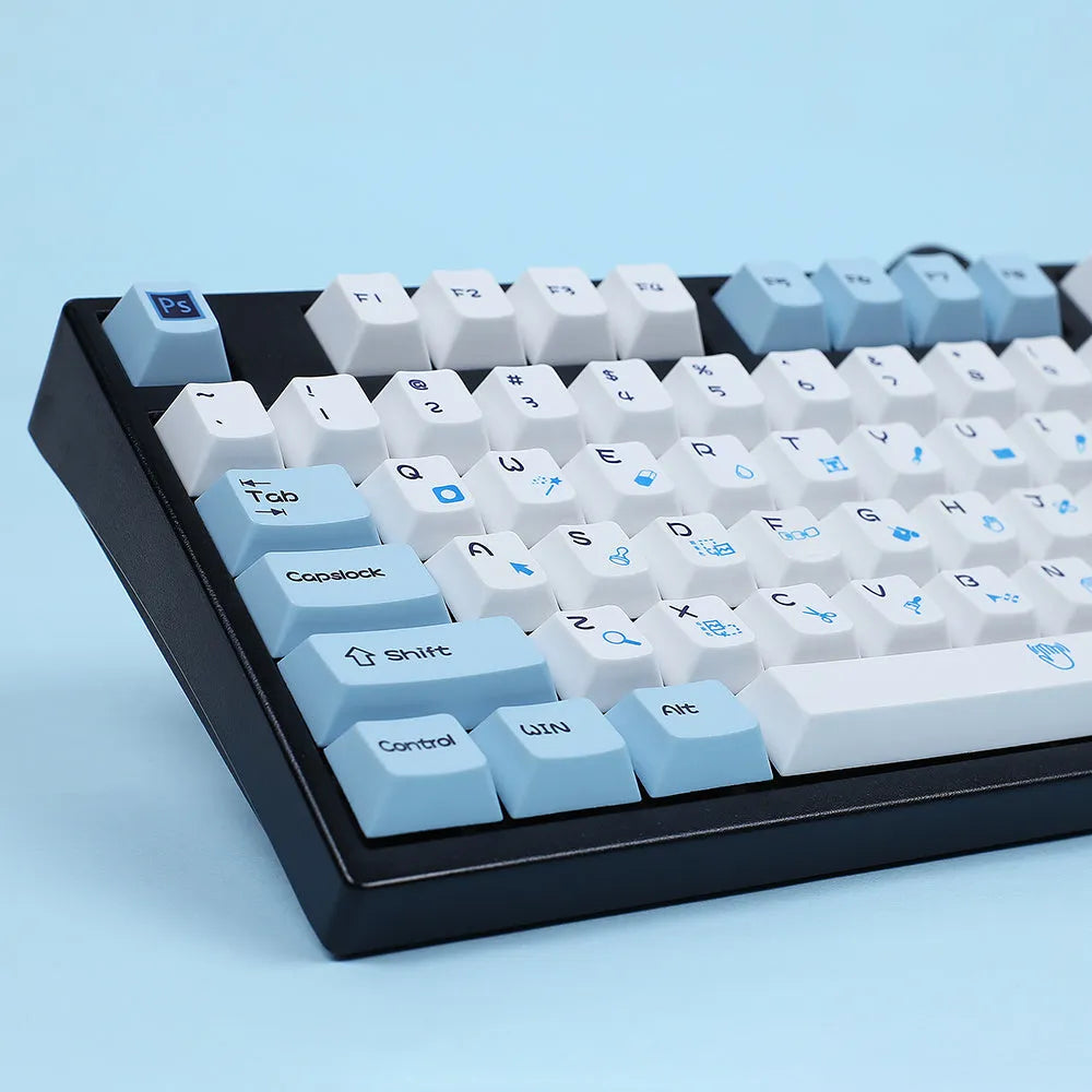 PlayStation-themed mechanical keyboard keycaps in blue and white or grey and white colour options