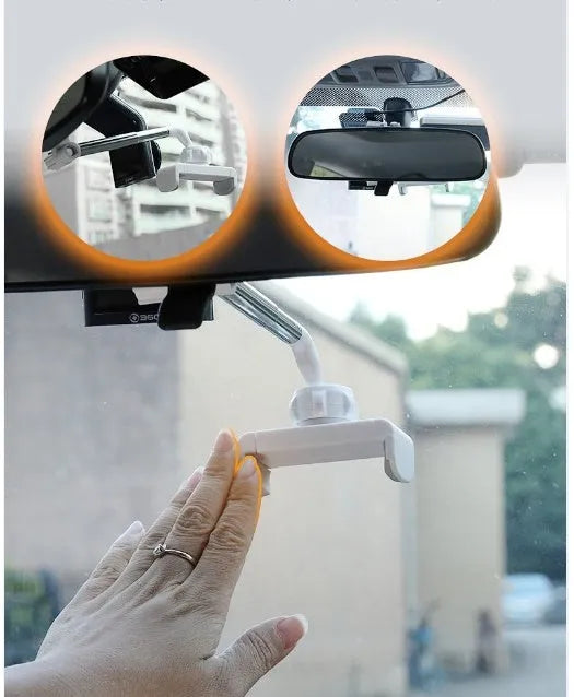 Black car mobile phone holder snapped onto a rearview mirror with cylindrical support frame, showing a smartphone in place.