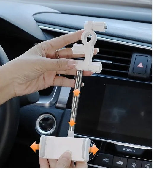 Black car mobile phone holder snapped onto a rearview mirror with cylindrical support frame, showing a smartphone in place.