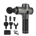 Black electric massage gun with multiple interchangeable heads on a grey background