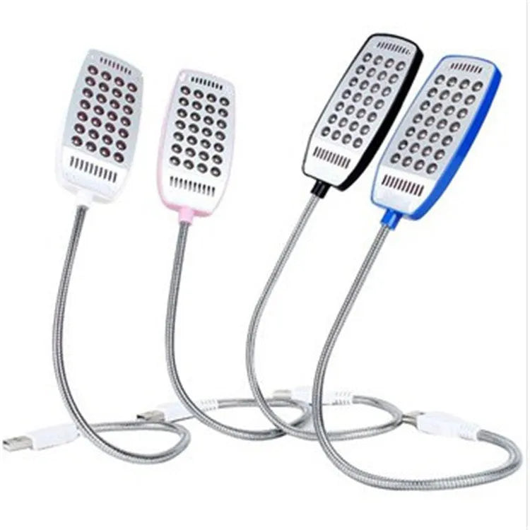 Black flexible gooseneck USB LED desk lamp bent over a book