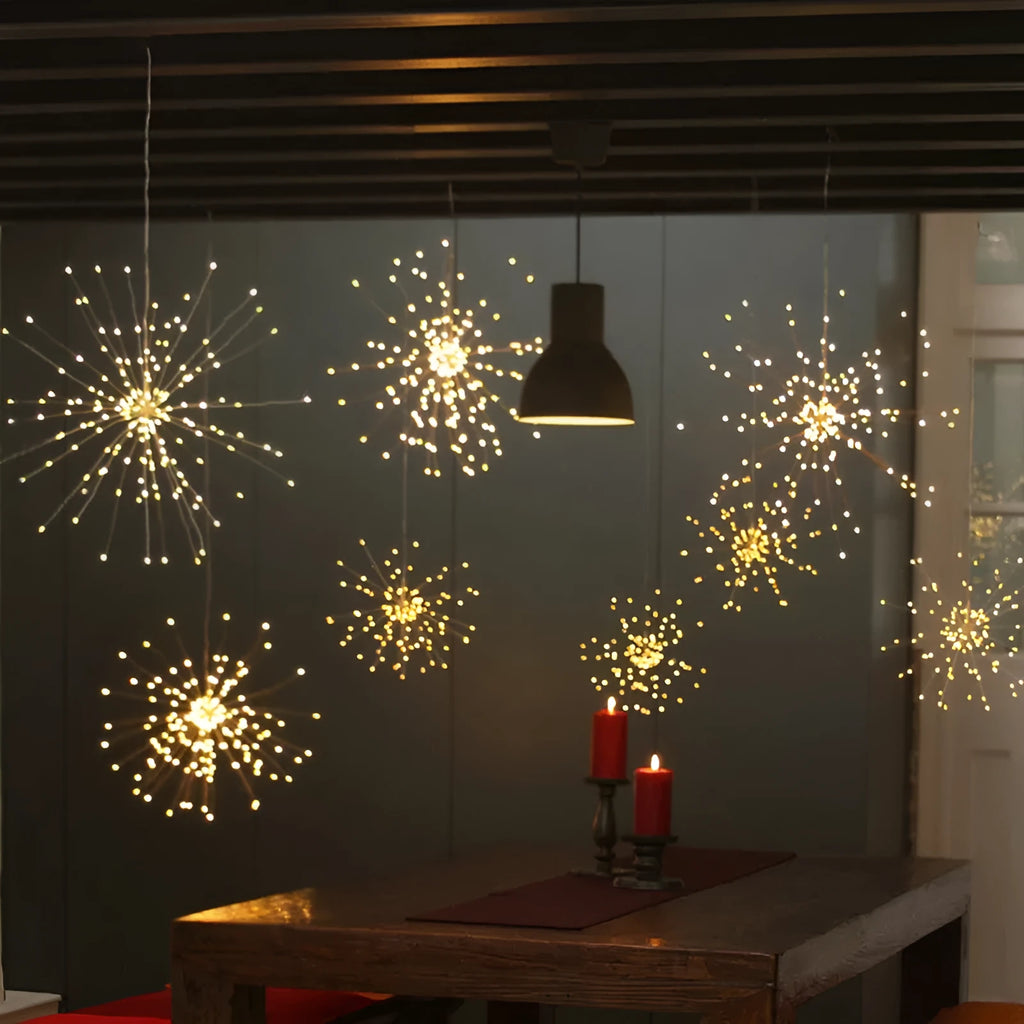 Solar-powered LED meteor shower string lights with remote control hanging outdoors.