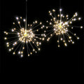 Solar-powered LED meteor shower string lights with remote control hanging outdoors.