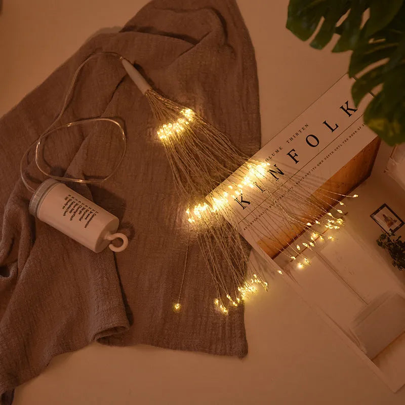 Solar-powered LED meteor shower string lights with remote control hanging outdoors.