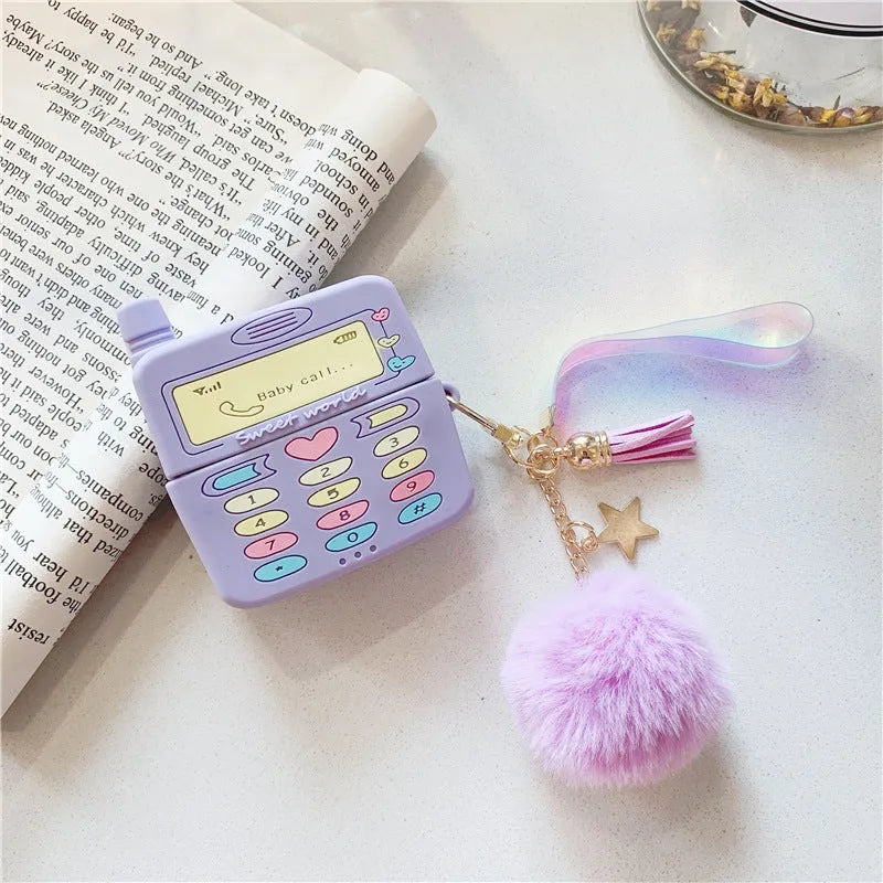 Purple silicone protective case for Apple AirPods wireless headphones with attached fur ball pendant accessory