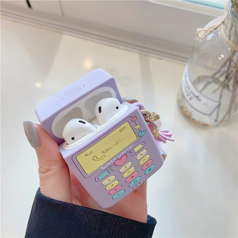 Purple silicone protective case for Apple AirPods wireless headphones with attached fur ball pendant accessory
