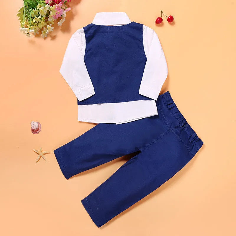 Blue boys' casual suit comprising a turtleneck, waistcoat, tie, and trousers on a hanger.