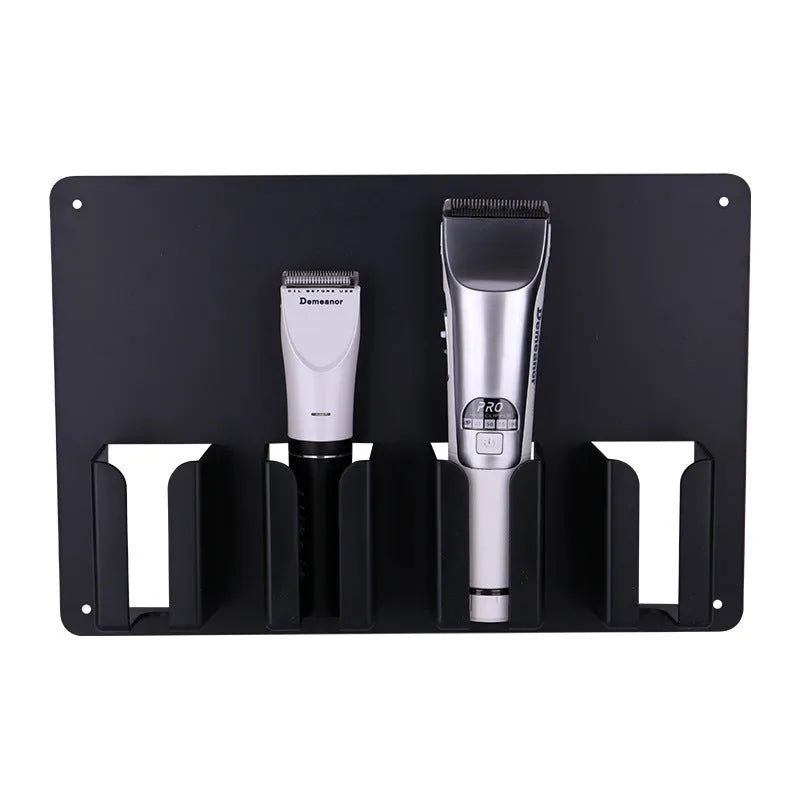 Black plastic clipper display box storage frame mounted on wall holding four electric hairdressing clippers