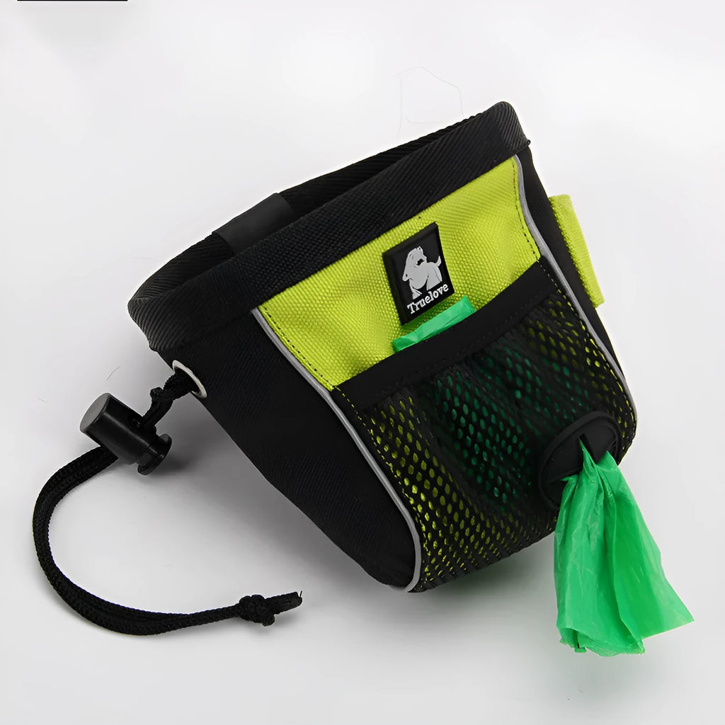 Green canvas dog training waist bag with a clip closure and removable waste bag compartment, shown on a belt.