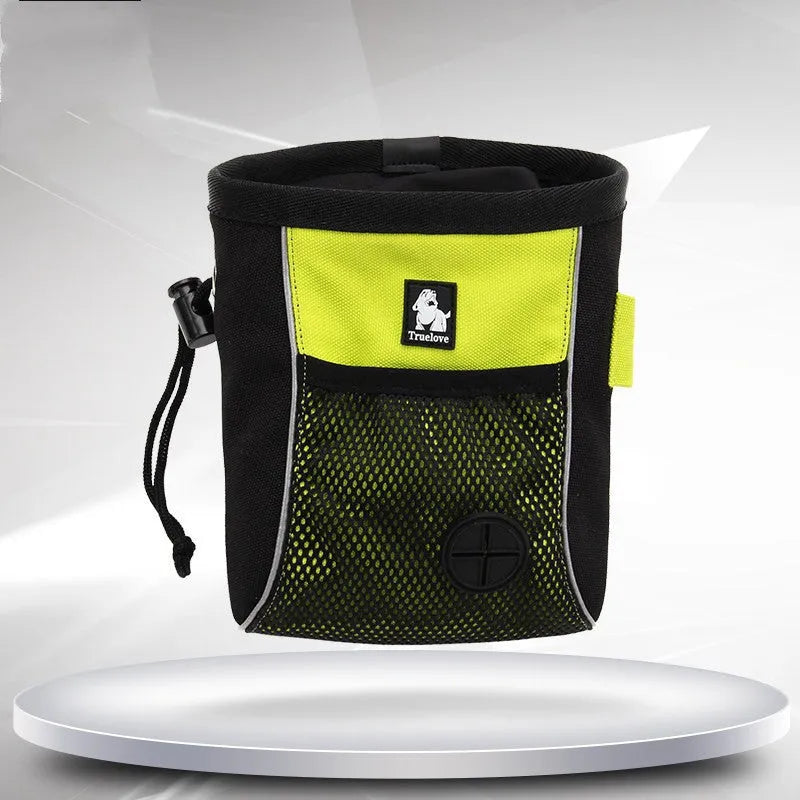 Green canvas dog training waist bag with a clip closure and removable waste bag compartment, shown on a belt.