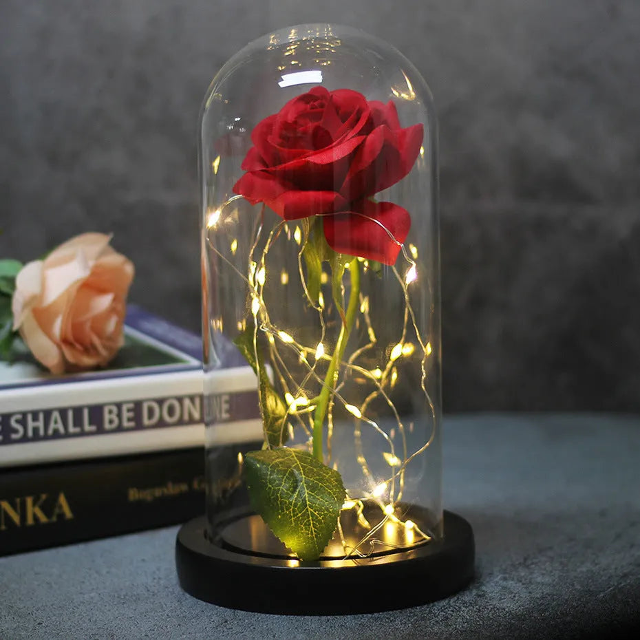 Silk flannel rose bouquet with glowing LED string lights on a wooden base, inside a gift box.