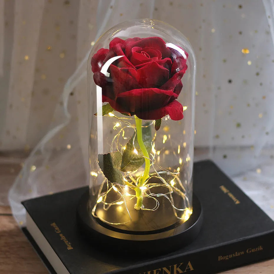 Silk flannel rose bouquet with glowing LED string lights on a wooden base, inside a gift box.
