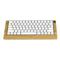 Bamboo holder for Apple Bluetooth Keyboard 2nd Generation with primary colour finish on desk