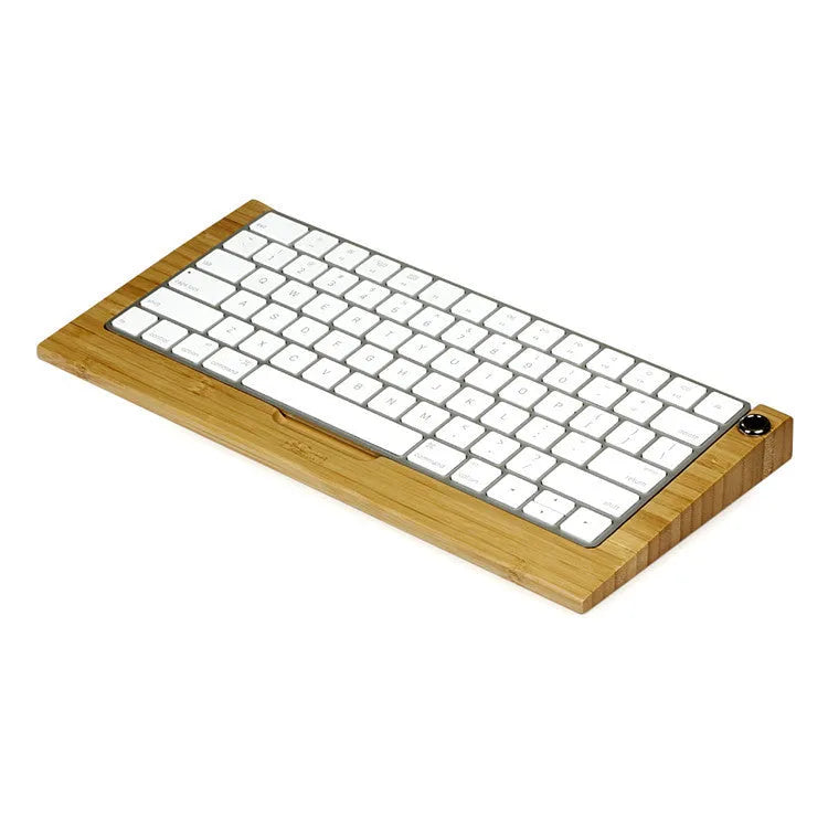 Bamboo holder for Apple Bluetooth Keyboard 2nd Generation with primary colour finish on desk