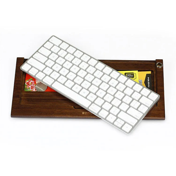 Bamboo holder for Apple Bluetooth Keyboard 2nd Generation with primary colour finish on desk