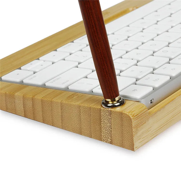 Bamboo holder for Apple Bluetooth Keyboard 2nd Generation with primary colour finish on desk