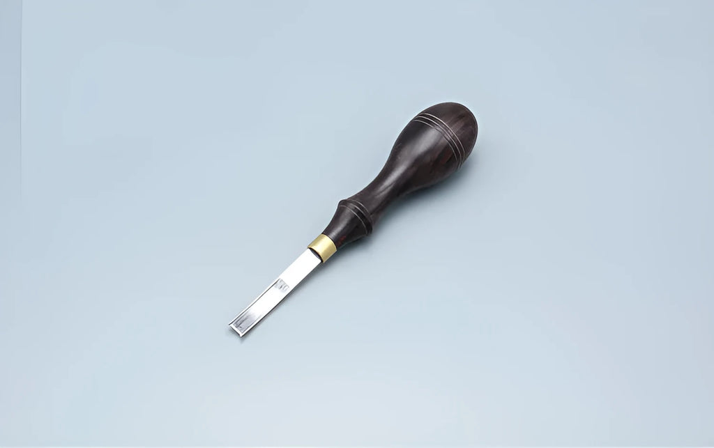 Leathercraft drum shovel edge shaver thinning knife with leather handle for wide edge sections.
