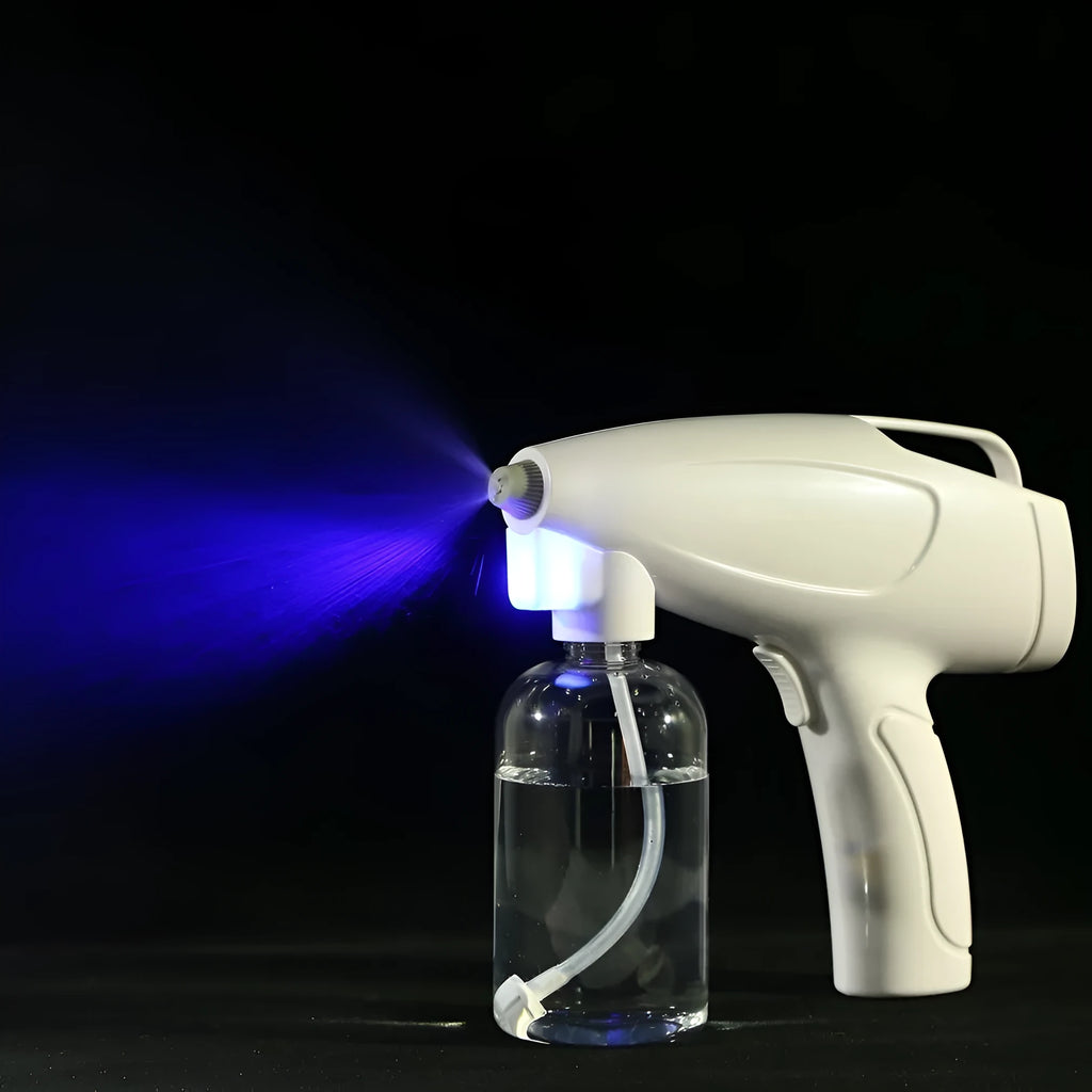 White handheld wireless electric spray disinfection gun with bottle and USB cable