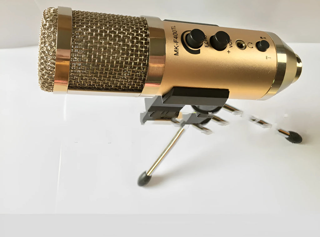 Gold-coloured wireless condenser microphone for mobile phone and computer with included bracket.