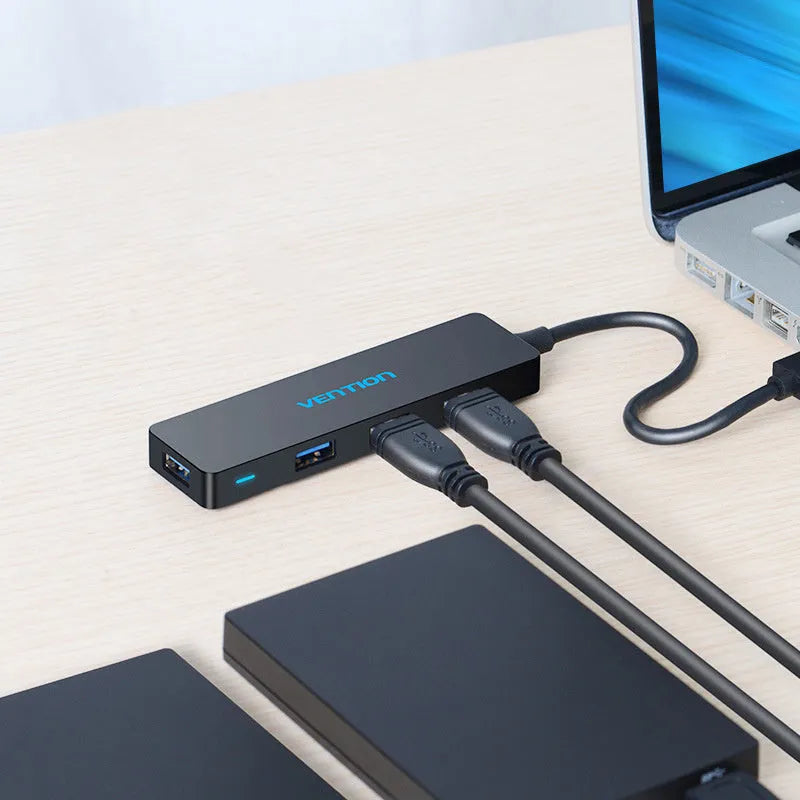 Black USB 3.0 four-port hub with nickel-plated connectors and braided 0.15 metre cable