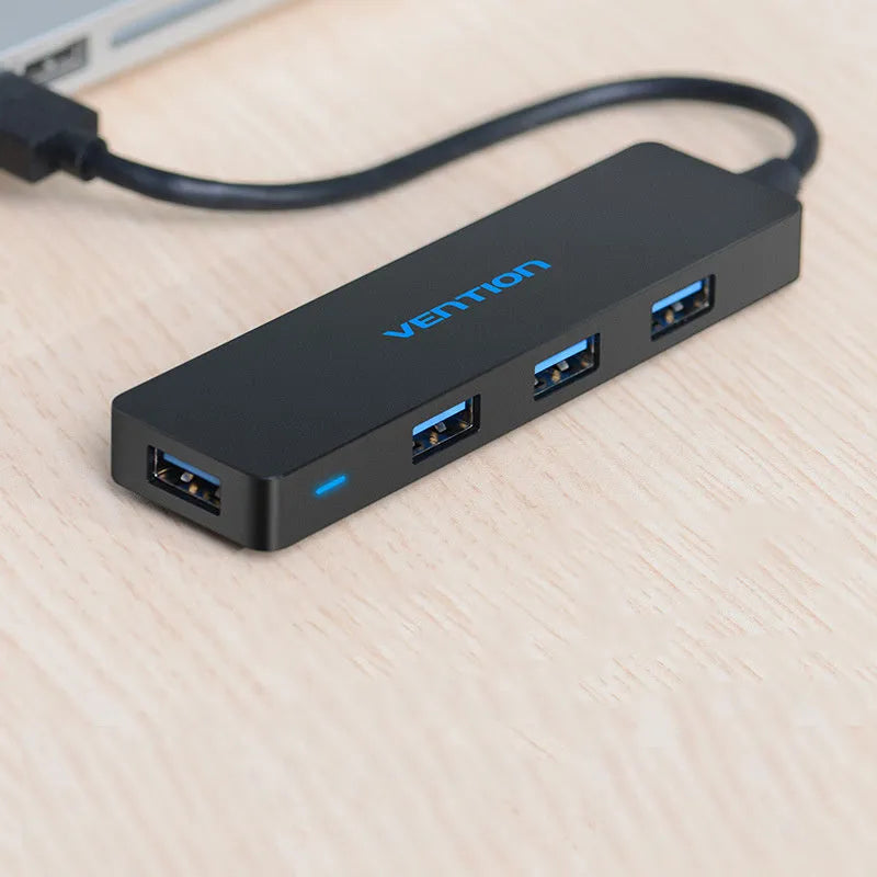 Black USB 3.0 four-port hub with nickel-plated connectors and braided 0.15 metre cable