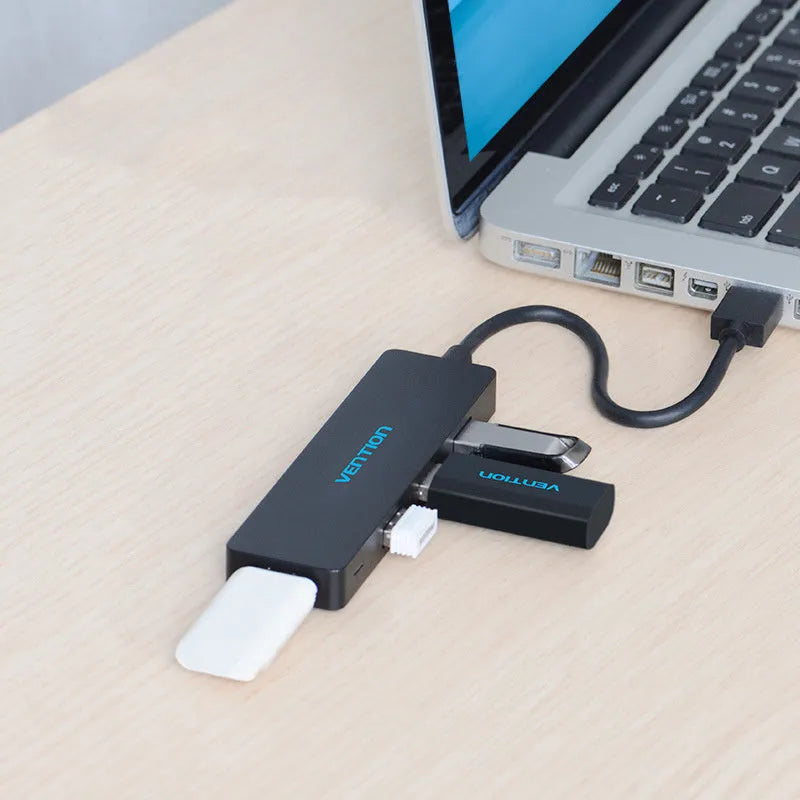 Black USB 3.0 four-port hub with nickel-plated connectors and braided 0.15 metre cable