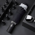 Automatic reverse umbrella showing three-fold design and plastic non-slip handle