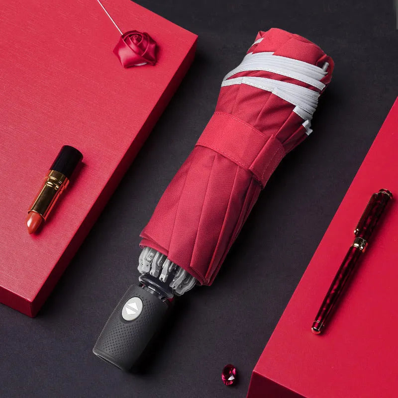 Automatic reverse umbrella showing three-fold design and plastic non-slip handle