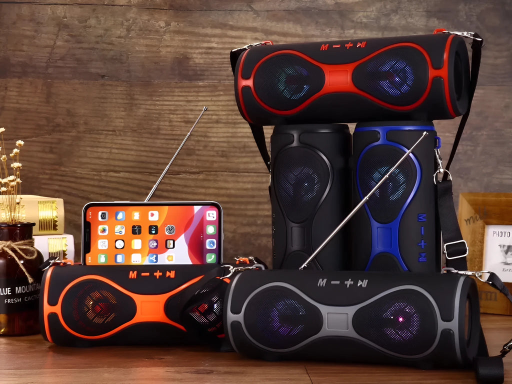 Compact multifunctional Bluetooth speaker with lantern light, strap, and phone stand in five colour options.