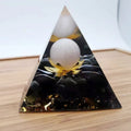 Black resin pyramid ornament 60x60mm on a white surface with white square paper box packaging
