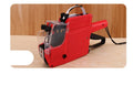 Manual price labelling coding machine in blue, red, or yellow with ink roller and paper.