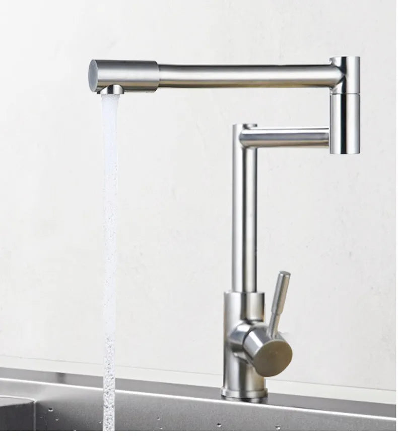 Silver stainless steel kitchen faucet with dual handles and rotating spout