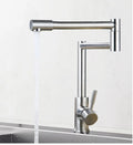 Silver stainless steel kitchen faucet with dual handles and rotating spout