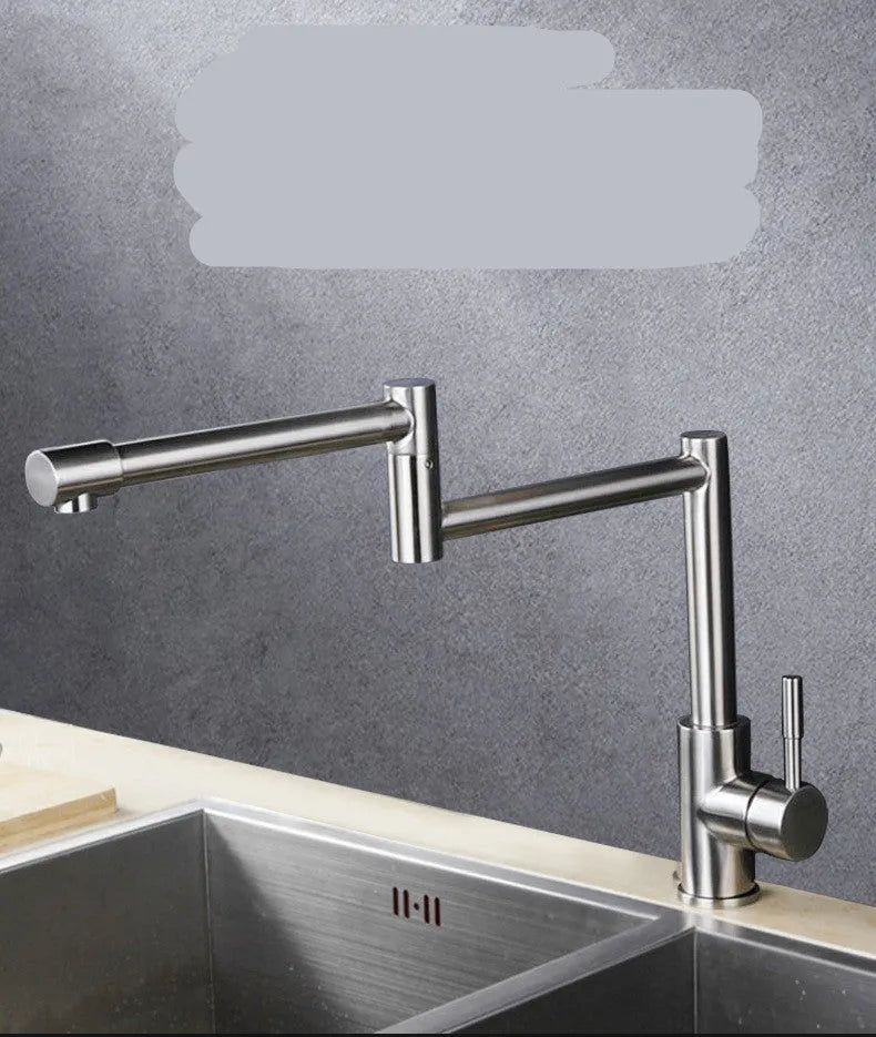 Silver stainless steel kitchen faucet with dual handles and rotating spout