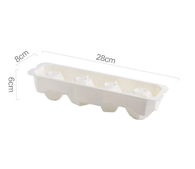 Silicone ice tray showing large mould cavities for ice hockey, spherical, round, and pentagonal shaped ice cubes.